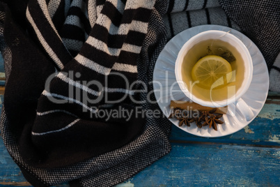 Overhead view of green tea by sweater