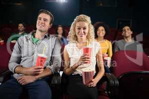 Couple watching movie in theatre