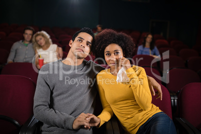 Couple watching movie in theatre