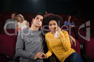 Couple watching movie in theatre