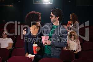 Couple looking at each other movie in theatre