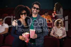 Couple hugging each other movie in theatre