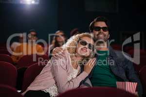 Couple watching movie in theatre