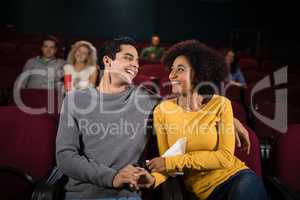 Couple watching movie in theatre