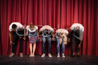 Actors bowing on the stage