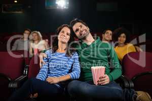 Couple watching movie in theatre