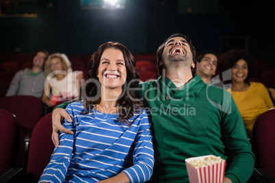 Couple watching movie in theatre