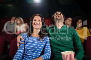 Couple watching movie in theatre