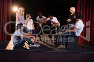 Actors practicing play on stage