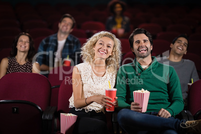 Couple watching movie in theatre