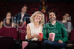 Couple watching movie in theatre