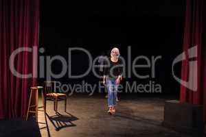 Actors practicing play on stage