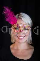 Woman wearing masquerade mask