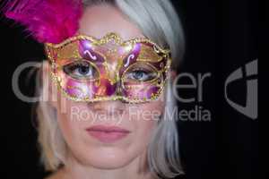 Woman wearing masquerade mask