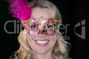 Woman wearing masquerade mask