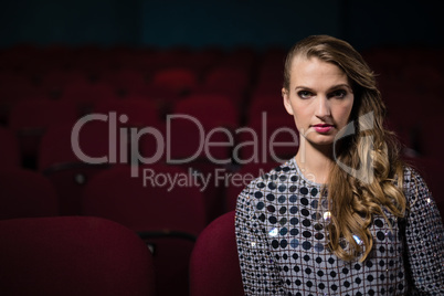 Woman watching movie in theatre