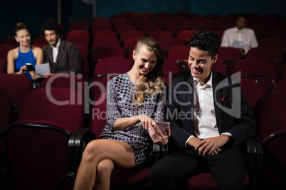 Couple watching movie in theatre