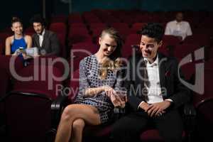 Couple watching movie in theatre