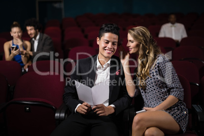 Couple interacting in theatre