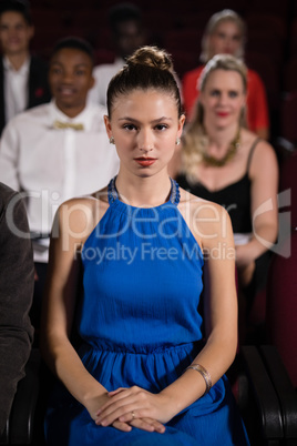 Woman sitting in movie theatre