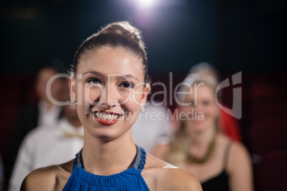 Woman sitting in movie theatre