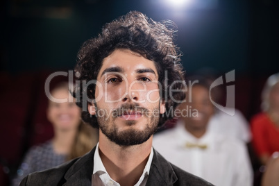 Man sitting in movie theatre