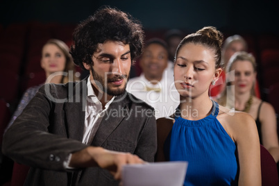 Couple interacting in theatre