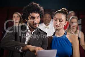 Couple interacting in theatre
