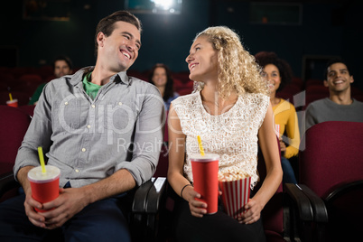 Couple watching movie in theatre