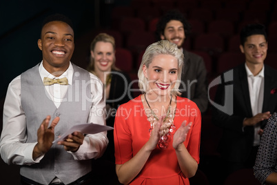 Group of people applauding