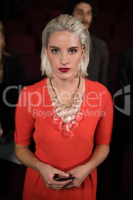 Woman standing in movie theatre