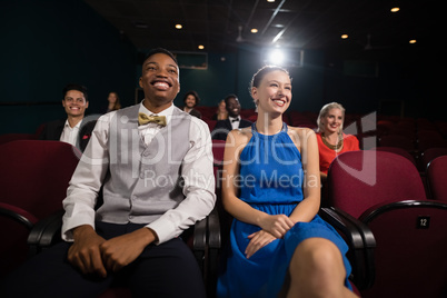 Couple watching movie in theatre