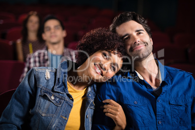 Couple watching movie in theatre