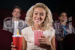 Woman watching movie in theatre