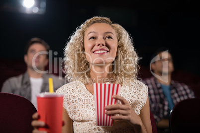 Woman watching movie in theatre