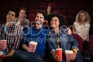 Couple watching movie in theatre