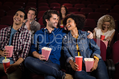 Couple watching movie in theatre