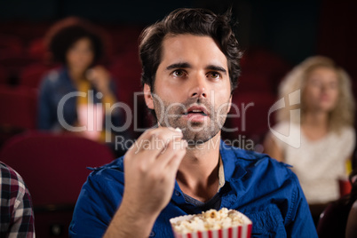 Man watching movie in theatre