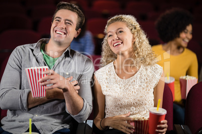 Couple watching movie in theatre