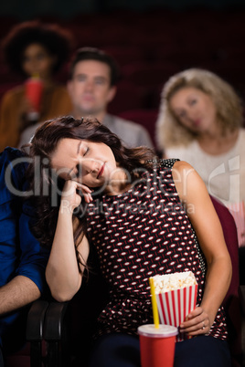 Woman sleeping in theatre