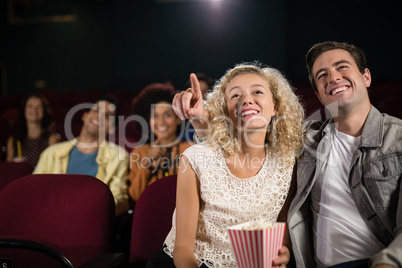 Couple watching movie in theatre