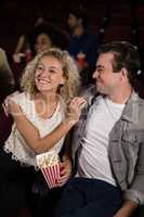 Couple watching movie in theatre