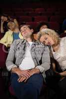 Couple sleeping in theatre