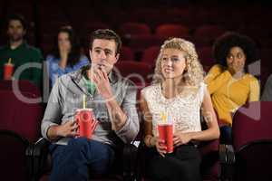 Couple watching movie in theatre