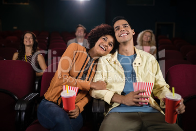 Couple watching movie in theatre