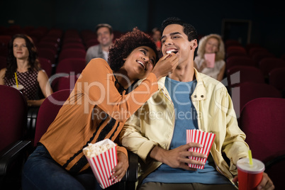 Couple watching movie in theatre