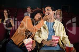 Couple watching movie in theatre