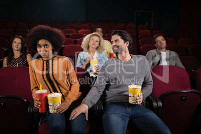 Couple watching movie in theatre