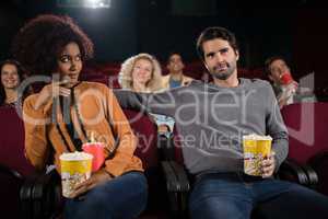 Couple watching movie in theatre