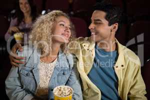 Couple watching movie in theatre